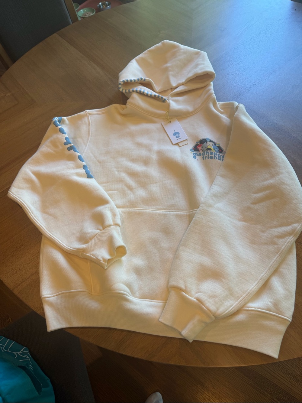Madhappy Cream Hoodie with Blue Graphic and Sleeve Detail